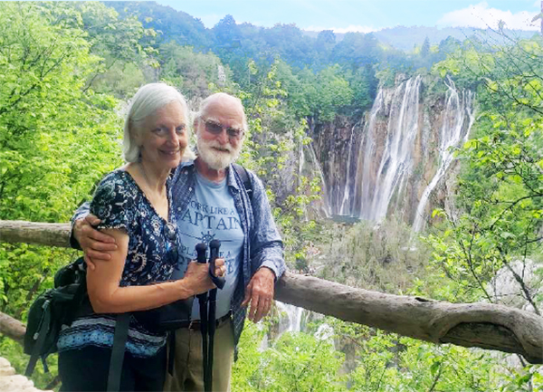 photo of Emily Glazer and Karl Kosok in front of a waterfall in Croatia
