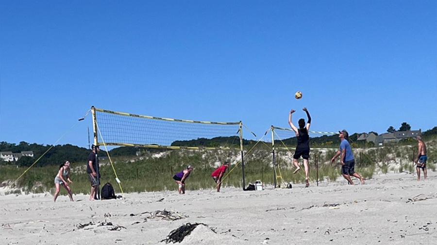 Photo of Santi serving a volleyball
