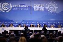 A photograph of the head table at COP27.