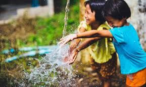 Picture of two children enjoying water